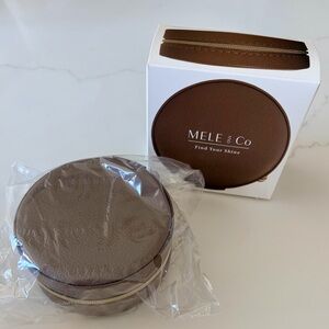 Mele and Co  Stow and Go mini round travel jewelry case